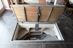 Motorised recessed cellar door