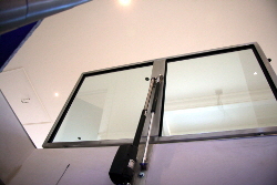 Rectangular motorised glass cellar door