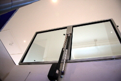 Rectangular motorised glass cellar door