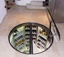 Circular glass cellar door