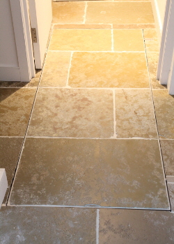 Recessed motorised cellar door with flagstones